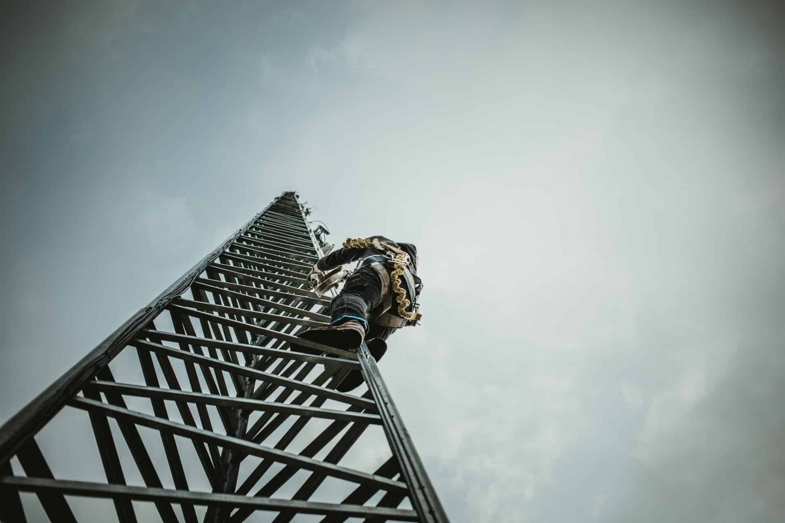 telecom worker climbing antenna tower 1