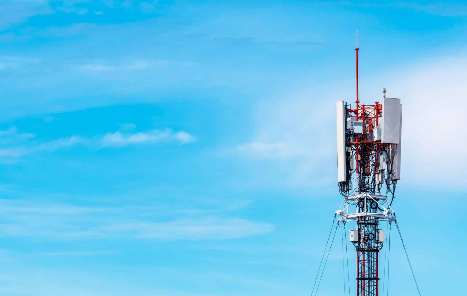 telecommunication tower with blue sky and white clouds background antenna on blue sky radio and sa